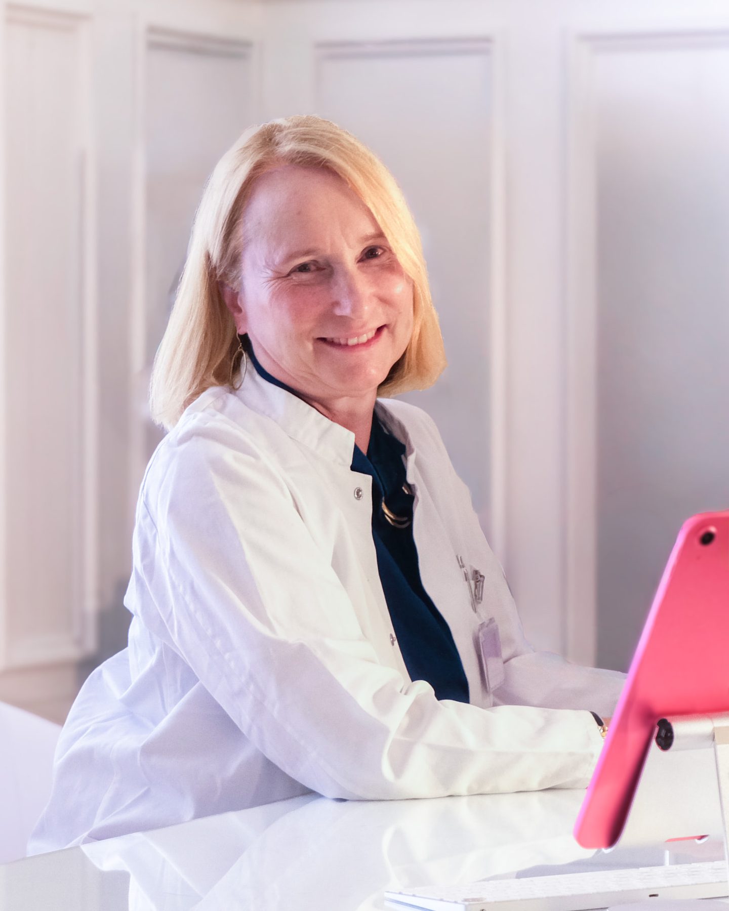 Dr. Anna Margareta Wagner at her desk, looking into the camera